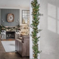 First Traditions™ Collection 9ft. Pre-Lit Artificial North Conway Garland With Glittery Cones & Eucalyptus, 100 Clear Lights -Michaels Shop D675898S 2